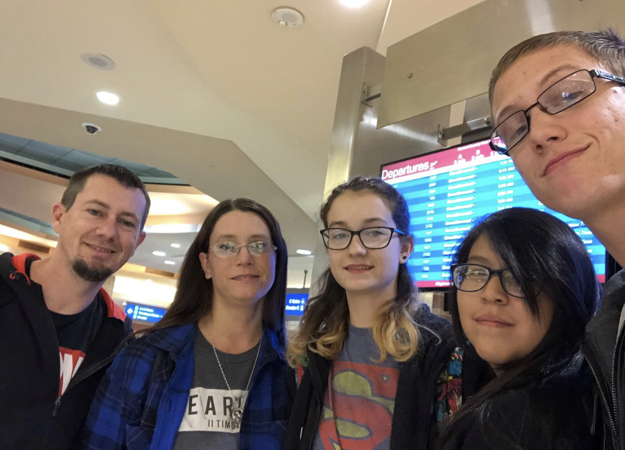 Group picture with family in an airport